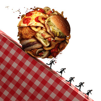 Cholesterol health danger as Junk food eating and dealing with a nutrition medical urgency concept as people running away to avoid an unhealthy diet with a ball made of greasy snacks as hamburgers and french fries with 3D illustration elements.